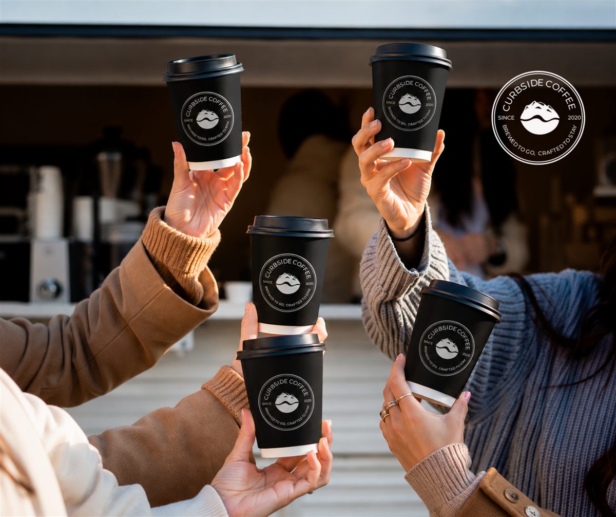 Hands pouring Curbside Coffee between cups